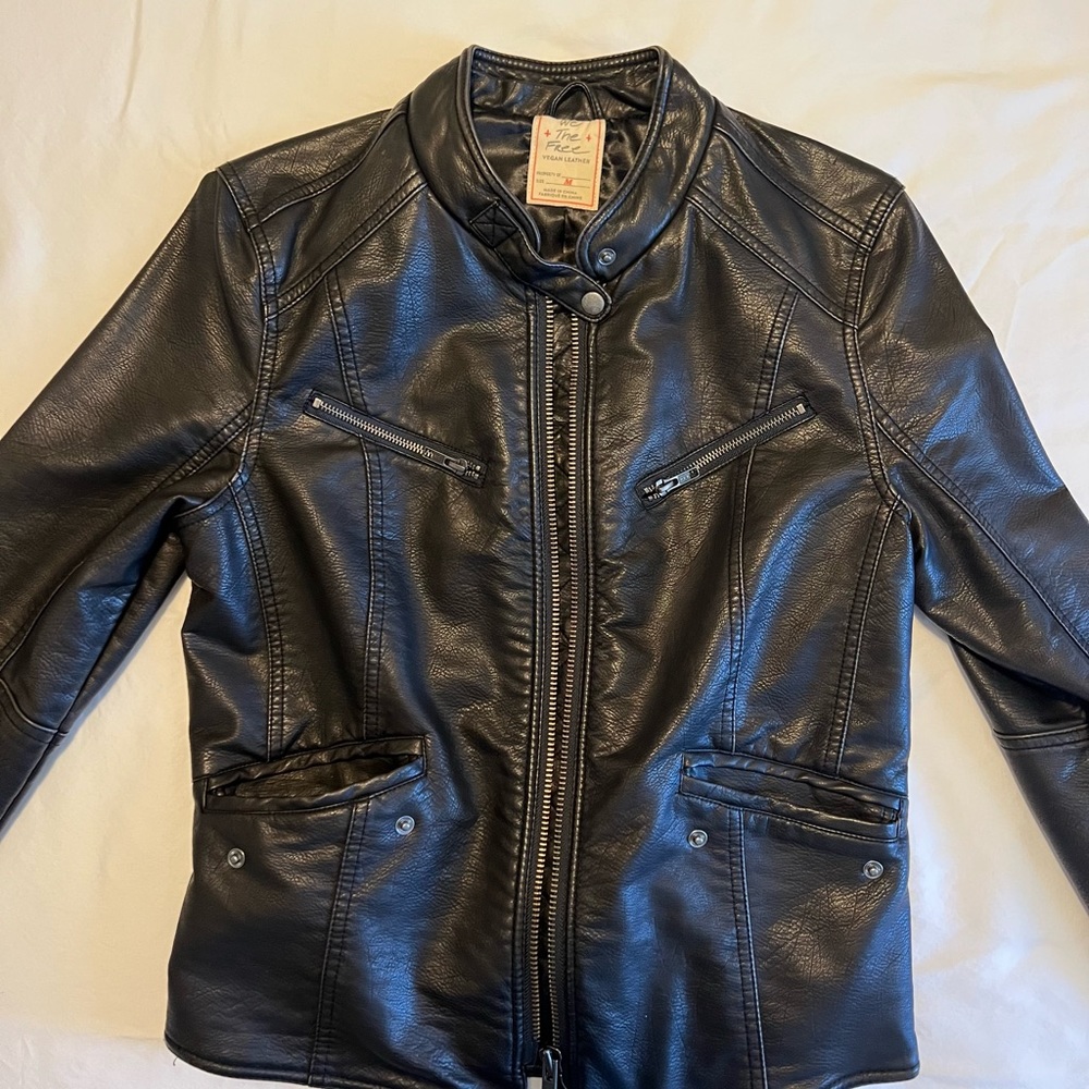 “We the Free” Vegan Leather Jacket with adjustable zipper hoody.